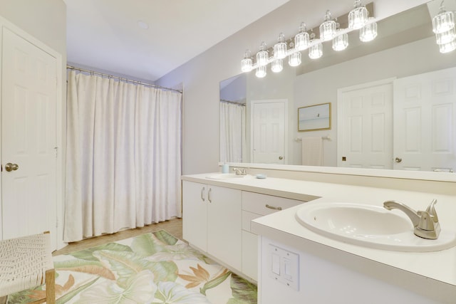 2633 SE Export Ave, Port Saint Lucie, FL 34952 - bathroom featuring double vanity and curtained shower