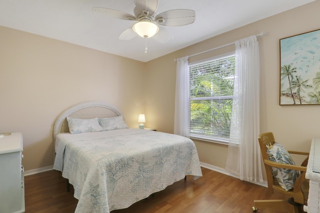 2633 SE Export Ave, Port Saint Lucie, FL 34952 - bedroom with wood finished floors, baseboards, and ceiling fan