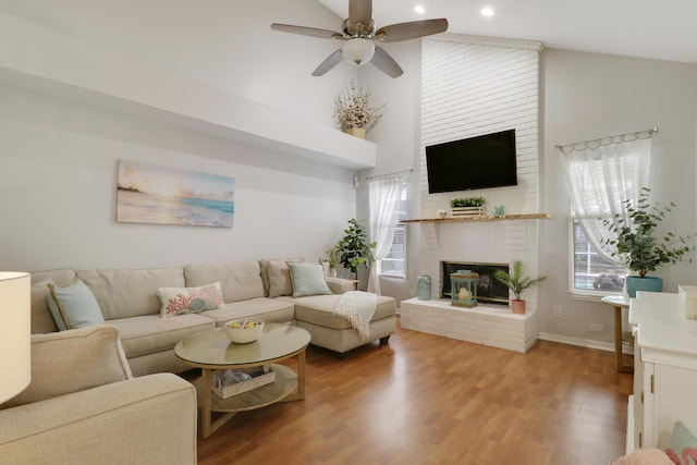 2633 SE Export Ave, Port Saint Lucie, FL 34952 - living area with a brick fireplace, a ceiling fan, light wood finished floors, recessed lighting, and baseboards