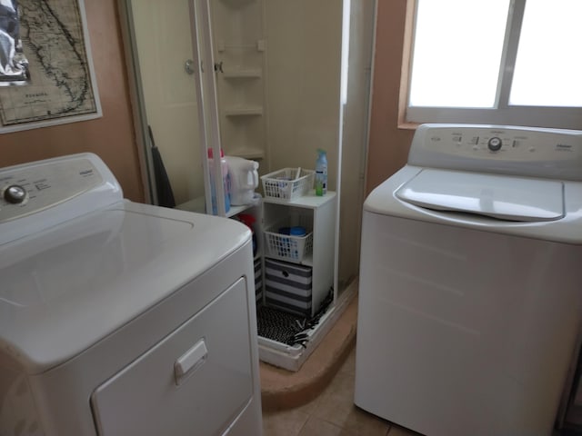127 SW 12th Ave, Boynton Beach, FL 33435 - washroom featuring light tile patterned flooring and washing machine and dryer