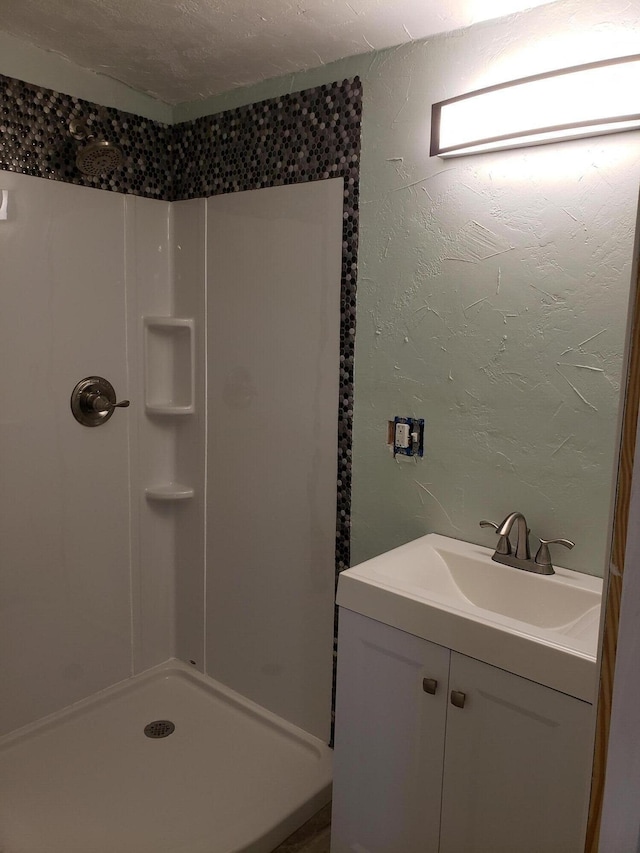 127 SW 12th Ave, Boynton Beach, FL 33435 - full bath with vanity, a shower, and a textured wall