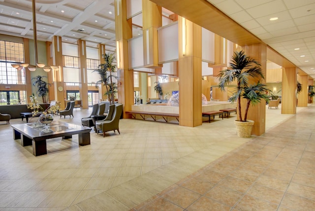 187 Preston E, Boca Raton, FL 33434 - building lobby with a towering ceiling, beam ceiling, recessed lighting, and coffered ceiling