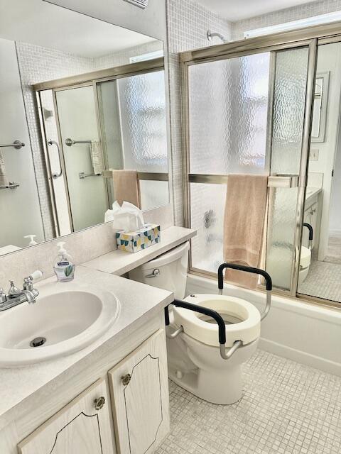 187 Preston E, Boca Raton, FL 33434 - bathroom featuring toilet, vanity, shower / bath combination with glass door, and tile patterned flooring