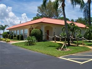 1947 SW Palm City Rd Unit G, Stuart, FL 34994 - view of front of home featuring a front lawn
