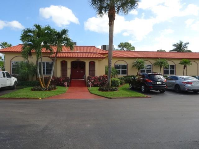 1947 SW Palm City Rd Unit G, Stuart, FL 34994 - mediterranean / spanish house featuring stucco siding and a tiled roof
