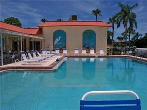 1947 SW Palm City Rd Unit G, Stuart, FL 34994 - community pool featuring a patio area