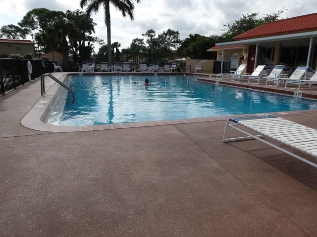 1947 SW Palm City Rd Unit G, Stuart, FL 34994 - community pool featuring a patio