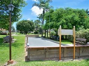 1947 SW Palm City Rd Unit G, Stuart, FL 34994 - surrounding community featuring a bocce ball area and a lawn
