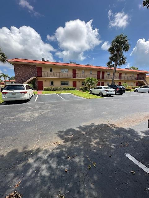 1947 SW Palm City Rd Unit G, Stuart, FL 34994 - view of uncovered parking lot