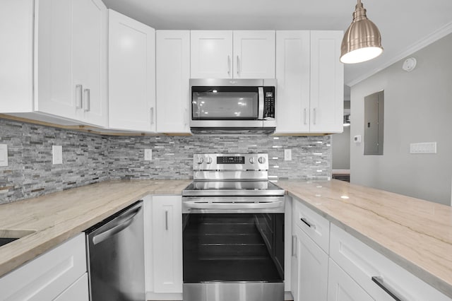 388 Tuscany G 388, Delray Beach, FL 33446 - kitchen featuring stainless steel appliances, electric panel, white cabinets, decorative backsplash, and ornamental molding