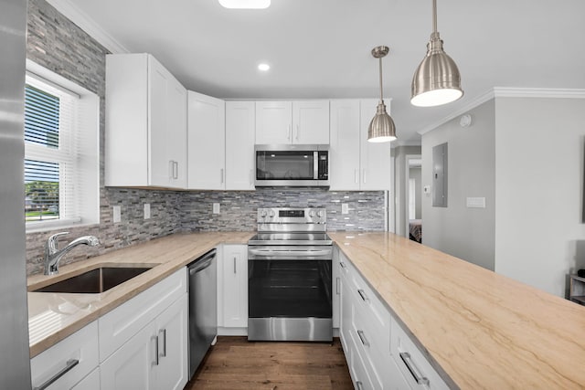 388 Tuscany G 388, Delray Beach, FL 33446 - kitchen featuring stainless steel appliances, a sink, ornamental molding, decorative backsplash, and light stone countertops