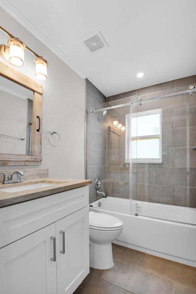 388 Tuscany G 388, Delray Beach, FL 33446 - bathroom featuring vanity, tile patterned floors, ornamental molding, toilet, and shower / bath combination with glass door