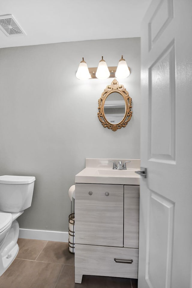 388 Tuscany G 388, Delray Beach, FL 33446 - half bath featuring vanity, toilet, tile patterned flooring, and baseboards