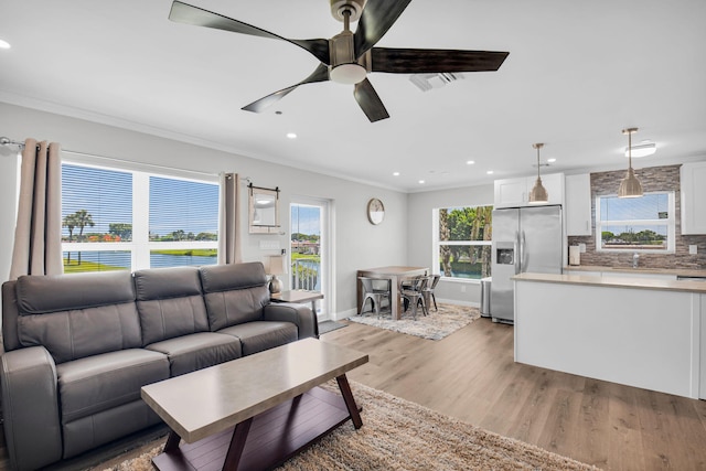388 Tuscany G 388, Delray Beach, FL 33446 - living area with crown molding, recessed lighting, ceiling fan, light wood-type flooring, and baseboards