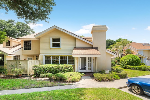 8111 Northboro Ct Unit 11B, Lake Clarke Shores, FL 33406 - traditional-style house with roof with shingles and a chimney