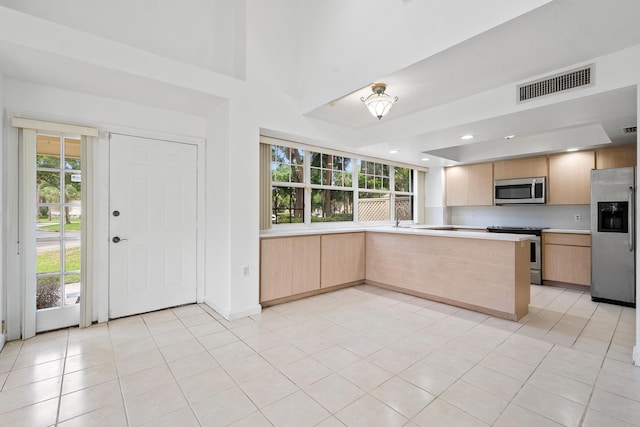 8111 Northboro Ct Unit 11B, Lake Clarke Shores, FL 33406 - kitchen with stainless steel appliances, light countertops, plenty of natural light, light brown cabinets, and recessed lighting