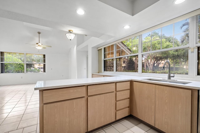 8111 Northboro Ct Unit 11B, Lake Clarke Shores, FL 33406 - kitchen with a sink, light tile patterned floors, light countertops, a peninsula, and ceiling fan