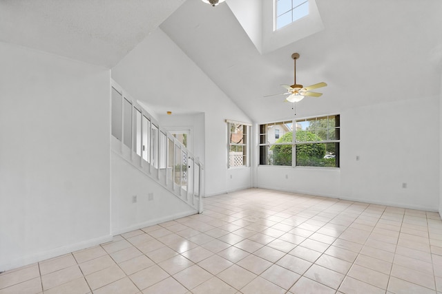 8111 Northboro Ct Unit 11B, Lake Clarke Shores, FL 33406 - tiled spare room featuring healthy amount of natural light, high vaulted ceiling, ceiling fan, stairway, and baseboards