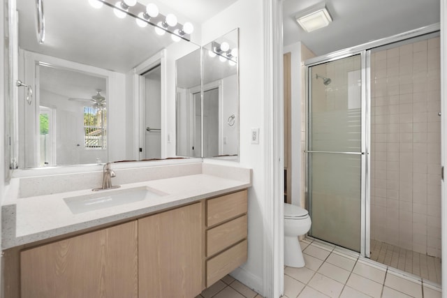 8111 Northboro Ct Unit 11B, Lake Clarke Shores, FL 33406 - bathroom with vanity, a shower stall, tile patterned floors, toilet, and a ceiling fan