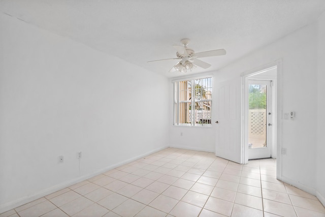 8111 Northboro Ct Unit 11B, Lake Clarke Shores, FL 33406 - spare room featuring ceiling fan, light tile patterned floors, and baseboards