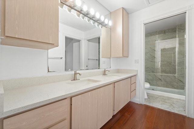 8111 Northboro Ct Unit 11B, Lake Clarke Shores, FL 33406 - bathroom with double vanity, a stall shower, toilet, and wood finished floors