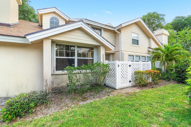 8111 Northboro Ct Unit 11B, Lake Clarke Shores, FL 33406 - view of front of house featuring stucco siding, a chimney, an attached garage, and a shingled roof