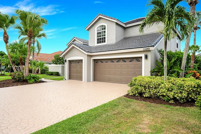21480 Halstead Dr, Boca Raton, FL 33428 - traditional-style house with stucco siding, a tiled roof, decorative driveway, an attached garage, and a front lawn