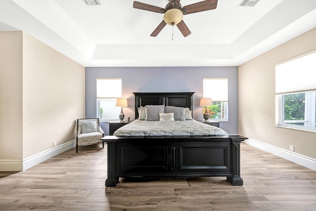 21480 Halstead Dr, Boca Raton, FL 33428 - bedroom with a raised ceiling, light wood-style floors, and ceiling fan