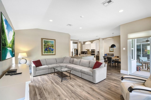 21480 Halstead Dr, Boca Raton, FL 33428 - living room with light wood-style flooring, a ceiling fan, arched walkways, and recessed lighting