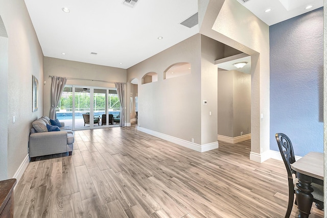 21480 Halstead Dr, Boca Raton, FL 33428 - living area featuring a textured wall, light wood-style floors, and recessed lighting