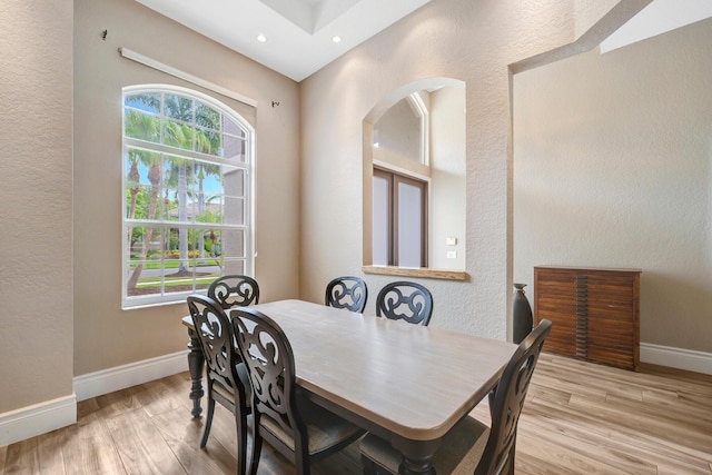 21480 Halstead Dr, Boca Raton, FL 33428 - dining room with wood finished floors, arched walkways, recessed lighting, and a textured wall