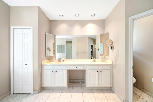 21480 Halstead Dr, Boca Raton, FL 33428 - bathroom with double vanity, a closet, and tile patterned flooring