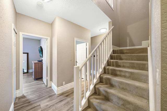 21480 Halstead Dr, Boca Raton, FL 33428 - staircase with wood finished floors and a textured wall