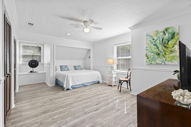 2070 Spring Pl, Vero Beach, FL 32963 - bedroom featuring light wood finished floors, crown molding, baseboards, a closet, and ceiling fan