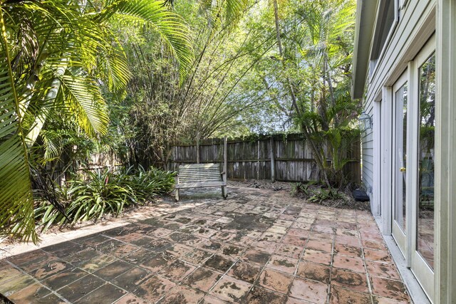 2070 Spring Pl, Vero Beach, FL 32963 - fenced backyard with a patio area