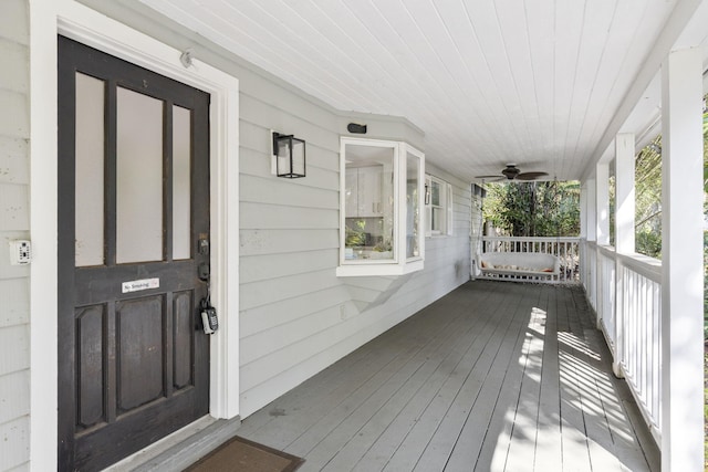2070 Spring Pl, Vero Beach, FL 32963 - wooden porch featuring a ceiling fan