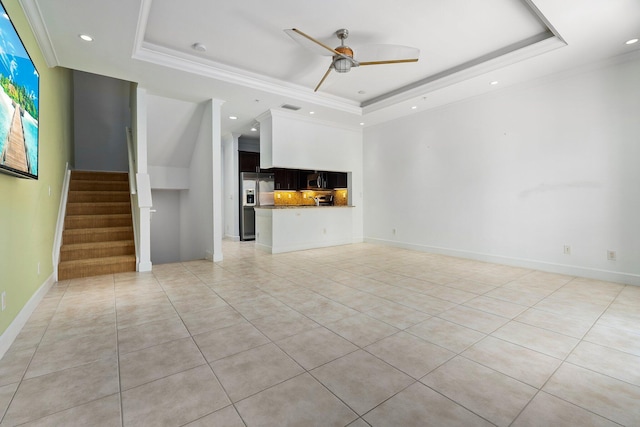 1579 Bow Line Rd, Fort Pierce, FL 34949 - unfurnished living room with a raised ceiling, ceiling fan, recessed lighting, crown molding, and light tile patterned floors