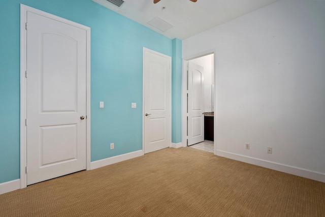 1579 Bow Line Rd, Fort Pierce, FL 34949 - unfurnished bedroom with light carpet, connected bathroom, and a ceiling fan