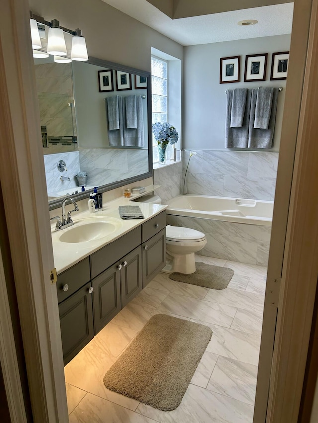 644 NW San Candido Way, Port Saint Lucie, FL 34986 - bathroom featuring a garden tub, vanity, toilet, marble finish flooring, and a shower