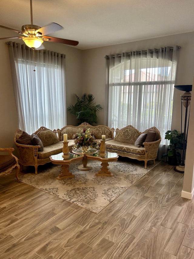 644 NW San Candido Way, Port Saint Lucie, FL 34986 - living area with light wood-type flooring, healthy amount of natural light, and a ceiling fan