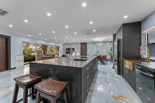1772 SW Commodore Pl, Palm City, FL 34990 - kitchen with stainless steel dishwasher, light marble finish floors, modern cabinets, a sink, and recessed lighting