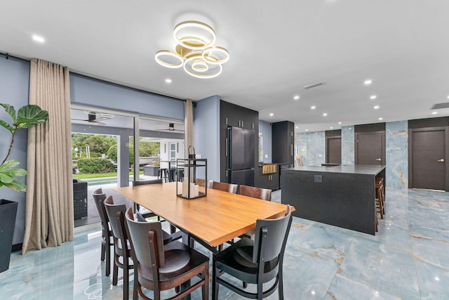 1772 SW Commodore Pl, Palm City, FL 34990 - dining room with light marble finish flooring and recessed lighting
