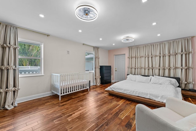 1772 SW Commodore Pl, Palm City, FL 34990 - bedroom featuring wood finished floors, baseboards, and recessed lighting