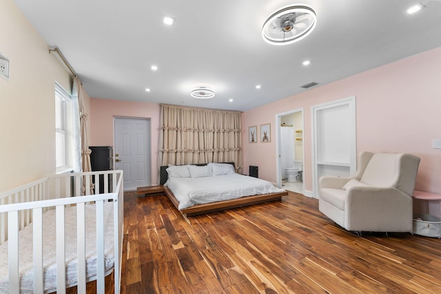 1772 SW Commodore Pl, Palm City, FL 34990 - bedroom with wood finished floors, recessed lighting, and ensuite bathroom