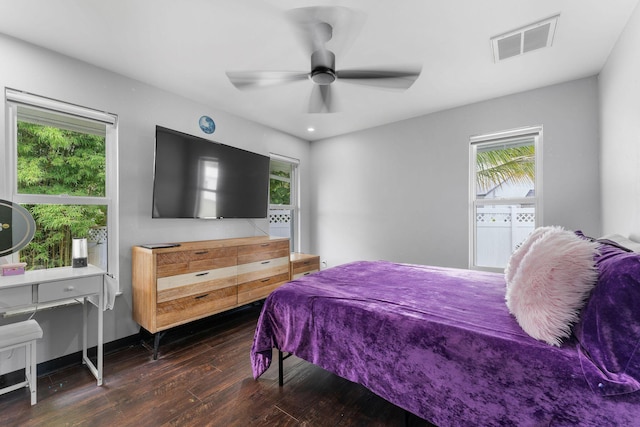 1772 SW Commodore Pl, Palm City, FL 34990 - bedroom with dark wood-type flooring, multiple windows, and a ceiling fan