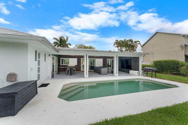 1772 SW Commodore Pl, Palm City, FL 34990 - swimming pool featuring a patio area and an outdoor hangout area