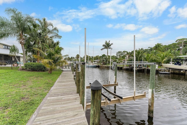 1772 SW Commodore Pl, Palm City, FL 34990 - dock featuring a water view, a yard, and boat lift