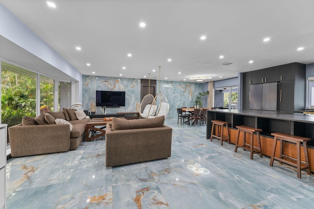 1772 SW Commodore Pl, Palm City, FL 34990 - living area featuring light marble finish flooring and recessed lighting