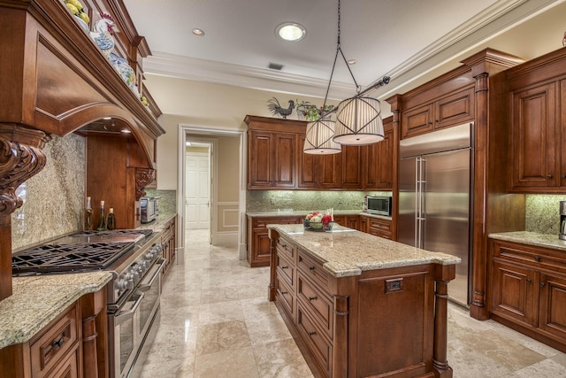 7656 Steeplechase Dr, Palm Beach Gardens, FL 33418 - kitchen featuring premium appliances, a kitchen island, decorative backsplash, ornamental molding, and light stone countertops