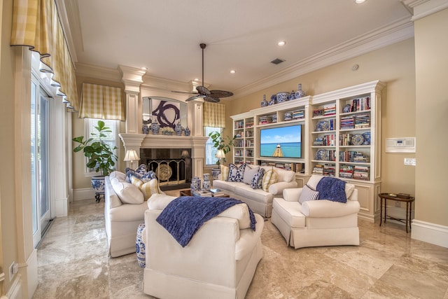 7656 Steeplechase Dr, Palm Beach Gardens, FL 33418 - living area featuring a ceiling fan, ornamental molding, a tiled fireplace, recessed lighting, and baseboards